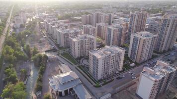 Tashkent, Uzbekistan - 8 4 2022. A drone flies over newly built high-rise buildings video