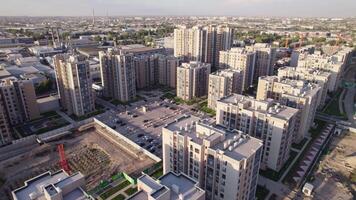 A drone flies over newly built high-rise buildings video