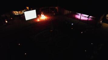 Drone filming a dancer with fire at night on an Arabian carpet video