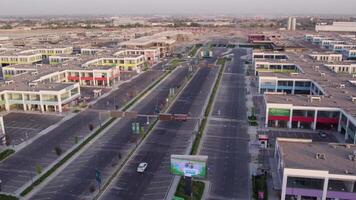 The drone flies over city buildings, roads, advertising structures video