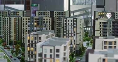 Panorama of miniature model of apartment buildings with landscape and roads video
