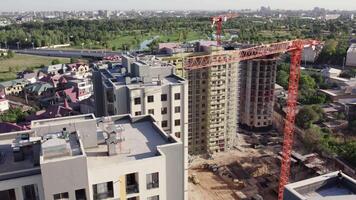 Tashkent, Uzbekistan - 8 4 2022. A drone flies over residential apartment buildings under construction video