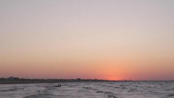 Man on the kiteboard rides in the evening video