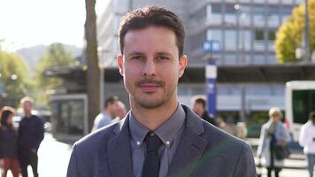 Lifestyle Portrait of Young Handsome Man in Suit Looking at Camera video