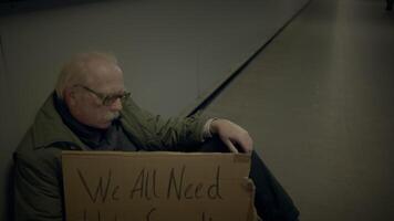 Elderly Homeless Man Suffering from Poverty Looking for Help at Train Station video