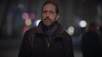 Male Person with Glasses Standing Out of the Crowd Thoughtfully Uncertain video