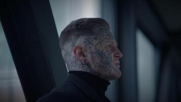 Intimidating Maverick Rebel Man with Head and Face Tattoos in Provoking Style video