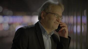 Positive Emotions of Elderly Ceo Boss Having a Phone Conversation at Night video