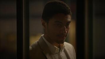 Young Man Waiting Alone at Train Station Platform at Night video