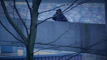 Hooded Fearless Woman Walking in Abandoned Urban Town at Twilight Light video