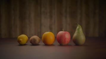 Assorted fruits displayed on hardwood table for local food event video