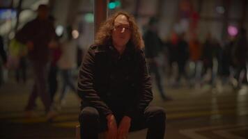 Man with Long Curly Hair Commuting Inside Train Station Watching People video