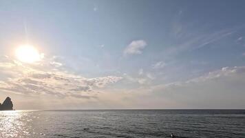 Timelapse fluffy Cumulus clouds moving in bright sunset sky over calm sea. Abstract aerial nature summer ocean sunset, sea and sky view. Vacation, travel, holiday concept. Weather and Climate Change video