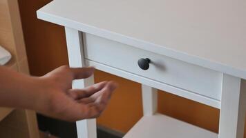 man's hand open drawer wooden in cabinet video