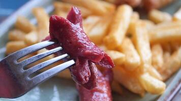 A plate of sausages and fries a delicious meat dish video