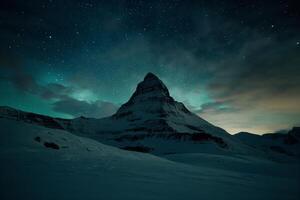 AI generated Majestic Nighttime View of a Snow-Covered Mountain Under a Starry Sky photo