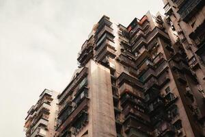 Aged of crowded narrow apartment, building exterior residential in housing estate photo