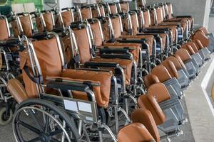 Rows empty wheelchairs parked at hospital photo