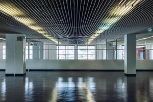 Empty corridor metallic ceiling with transparent windows photo
