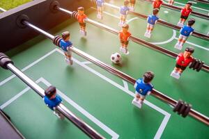 Close-up of Table football soccer game on green field photo