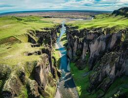 Fjadrargljufur rugged canyon naturally eroded with Fjadra river flowing in summer at Iceland photo