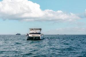 Luxury yacht floating on blue sea ripples in summer vacation photo