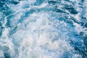 Sea wave breaking and splashing during climate change photo