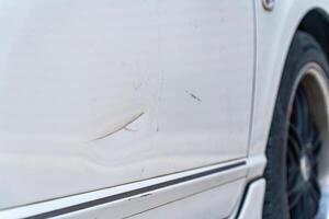 Car side body with scratch and dent damaged photo