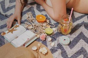 Girl with age and drink on the beach photo