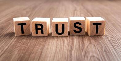 Wooden blocks with the word Trust. photo