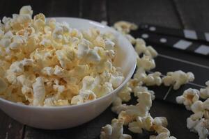 Popcorn on a wooden background photo