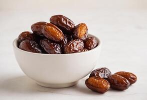 AI generated A bowl of iteema dates date on white background photo