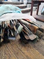 Various Brushes Arranged on Wooden Table photo