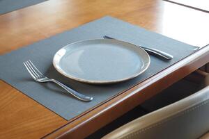 Empty blank ceramic dish on table photo