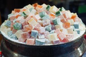 turkish delight or lokum of red, green, orange and yellow colors. photo