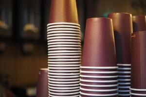 Lots of paper coffee cups at cafe photo