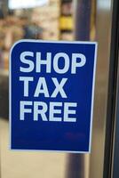 shop tax free text duty free shop sign on shop window photo