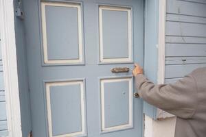 women hand knock the door photo