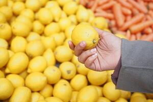 young women choosing Lemon selling in supermarkets in istanbul photo