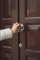 women hand knock the door photo