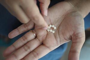 top view of artificial sweetener on hand photo