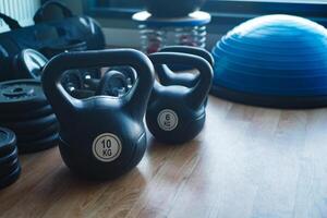 Gym Equipment or Dumbbell Kettlebell in a gym bench photo