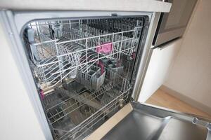 Inside of the empty dishwasher. photo