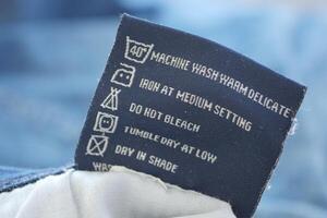 Clothing label with care symbols on a cloth photo