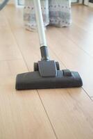 woman cleaning floor dust with vacuum cleaner. photo