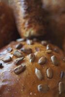 detail shot of sunflower seed baked bread on table photo