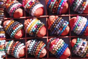 colorful women bracelets selling at local store in istanbul . photo