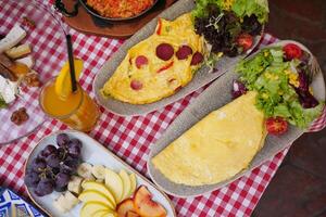 Egg Omelette with sausage on a breakfast table photo