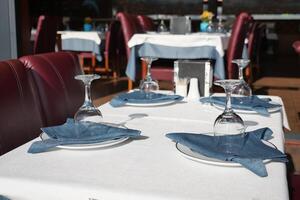 served and decorated round festive table in a restaurant photo