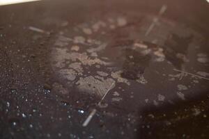 A black dirty electric stove. closeup . photo